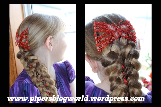 Piper wanted her beloved red butterfly clip, so I put that in her hair. The result looks like a very intricate Mermaid tail.