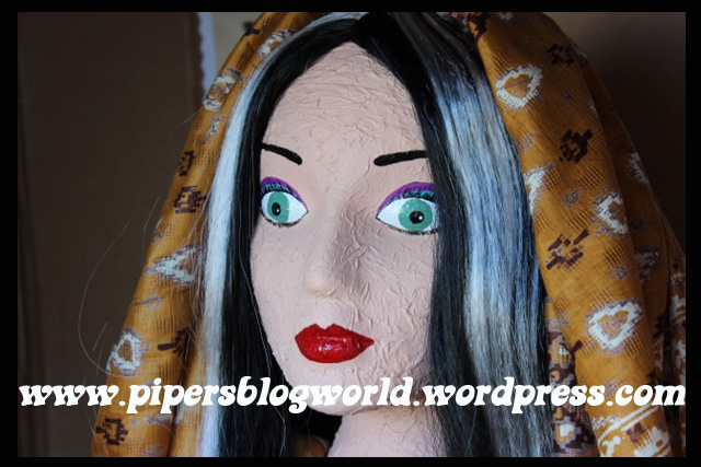 Piper added a wig and a huge silk wraparound scarf to complete the look.